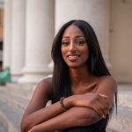 Portrait of an eastern african girl, smiling young lady outdoor in the city center.